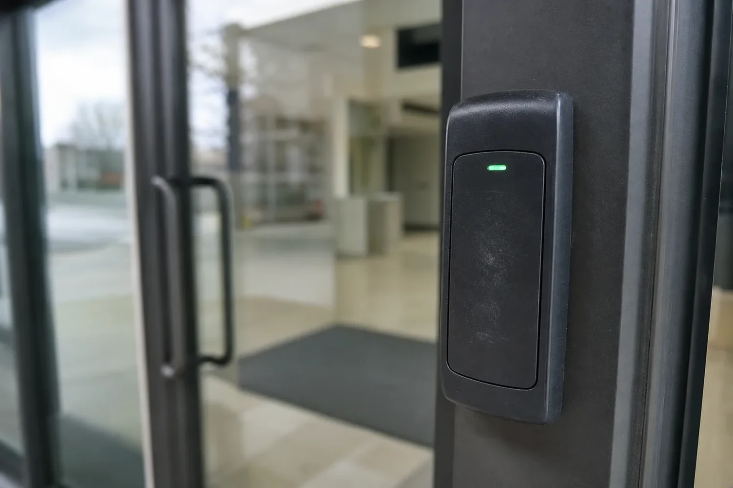 Access control card reader beside an office door